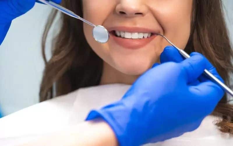 a girl in a dental clinic for dental cleanings