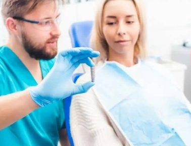 dentist showing gray implant